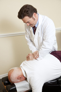Chiropractor performing an adjustment