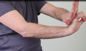 Tennis elbow test: stressing forearm muscles